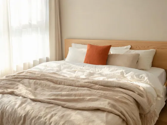 Bed with relaxed linen and quilt
